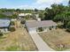 An aerial view showcases the home's curb appeal, landscaping, and desirable neighborhood at 219 Capatola St, Port Charlotte, FL 33948