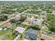 This elevated view shows a community with lush trees, quiet streets and appealing homes at 219 Capatola St, Port Charlotte, FL 33948