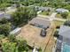 A large fenced backyard with a shed and trampoline is ready for Gathering fun and outdoor activities at 219 Capatola St, Port Charlotte, FL 33948