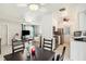 Bright open concept of kitchen, dining, and living area with ceiling fans and abundant natural light at 219 Capatola St, Port Charlotte, FL 33948