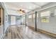 Spacious sunroom with wood-look floors, beadboard walls, and neutral paint colors at 219 Capatola St, Port Charlotte, FL 33948