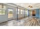 Bright sunroom has tile floors, beadboard walls and multiple windows that let in light at 219 Capatola St, Port Charlotte, FL 33948