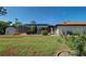 Well maintained backyard featuring a pool, screen enclosure, and lush landscaping at 2194 Abalom St, Punta Gorda, FL 33980