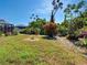 Landscaped backyard featuring lush greenery and a peaceful outdoor space at 2194 Abalom St, Punta Gorda, FL 33980