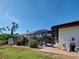 Lush backyard with screened pool, mature landscaping, and outdoor living space at 2194 Abalom St, Punta Gorda, FL 33980