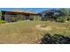 Expansive backyard with screened lanai and lush landscaping, offering privacy and tranquility at 2194 Abalom St, Punta Gorda, FL 33980