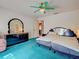 Spacious bedroom with blue carpeting and an expansive vanity at 2194 Abalom St, Punta Gorda, FL 33980
