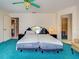 Bedroom with large bed, walk-in closet, and adjacent kitchen at 2194 Abalom St, Punta Gorda, FL 33980