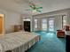 Spacious bedroom with glass paneled doors leading to an outdoor pool at 2194 Abalom St, Punta Gorda, FL 33980