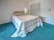 Bedroom with a closet, green carpet, and patterned comforter on the bed at 2194 Abalom St, Punta Gorda, FL 33980