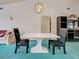 Dining room showcasing modern table set, unique lighting, and open layout at 2194 Abalom St, Punta Gorda, FL 33980