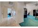 Hallway features neutral tile floors, multiple entrances, and leads to the main living areas at 2194 Abalom St, Punta Gorda, FL 33980