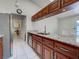 Renovated kitchen features stainless steel appliances, granite countertops, and plentiful cabinets at 2194 Abalom St, Punta Gorda, FL 33980