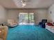 Bright living room with ample seating, open access to screened lanai and natural light at 2194 Abalom St, Punta Gorda, FL 33980