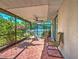 Covered lanai with ceiling fan and seating, perfect for outdoor relaxation and enjoyment at 2194 Abalom St, Punta Gorda, FL 33980