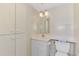A well-maintained bathroom featuring ample cabinet space and modern fixtures at 232 Saint Augustine Ave # 701, Venice, FL 34285