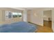 Well-lit bedroom with large window and ceiling fan. Includes built-in shelves at 232 Saint Augustine Ave # 701, Venice, FL 34285