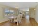 Bright dining area with large windows, a chandelier and a mirrored wall creating an expansive space at 232 Saint Augustine Ave # 701, Venice, FL 34285
