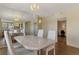 Bright dining area with marble table, chandelier and mirrored wall that makes the area look spacious at 232 Saint Augustine Ave # 701, Venice, FL 34285