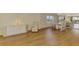 Bright dining room with hardwood floors, a dining table and a mirrored wall creating an expansive space at 232 Saint Augustine Ave # 701, Venice, FL 34285
