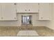 Kitchen sink with granite countertop with a view into the dining room at 232 Saint Augustine Ave # 701, Venice, FL 34285