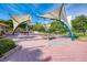 Community park features picnic tables, sun shades, water feature, lush landscaping and nearby amenities at 232 Saint Augustine Ave # 701, Venice, FL 34285
