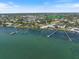 Aerial view of the property showing its location on the water, with boat docks at 2322 Bayshore Rd, Nokomis, FL 34275