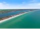 Aerial view of waterfront property in a coastal community with a beautiful beach at 2322 Bayshore Rd, Nokomis, FL 34275