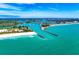 Spectacular aerial view of the coastline, highlighting the vibrant turquoise waters and scenic coastal landscape at 2322 Bayshore Rd, Nokomis, FL 34275