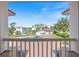 View from balcony showing neighborhood street, manicured lawns and other upscale homes at 2322 Bayshore Rd, Nokomis, FL 34275