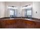 Elegant bathroom featuring double sinks, granite countertops, and decorative lighting at 2322 Bayshore Rd, Nokomis, FL 34275