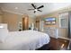 Inviting bedroom features hardwood floors, white trim, and a television at 2322 Bayshore Rd, Nokomis, FL 34275