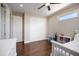 Bright bedroom with wood floors, closet, and large window providing plenty of natural light at 2322 Bayshore Rd, Nokomis, FL 34275