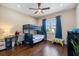 Bedroom features wood floors, a bunk bed, ceiling fan, and a desk under the window at 2322 Bayshore Rd, Nokomis, FL 34275