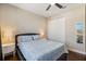 Bedroom with hardwood floors, a queen-sized bed, and matching bedside tables with lamps at 2322 Bayshore Rd, Nokomis, FL 34275