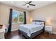 Bedroom featuring hardwood floors, a ceiling fan, and a bunk bed with dinosaur-themed bedding at 2322 Bayshore Rd, Nokomis, FL 34275