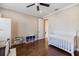 Well-lit Bedroom features hardwood floors and classic white furniture at 2322 Bayshore Rd, Nokomis, FL 34275