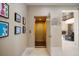 Hallway featuring an elevator, gallery wall and view into a large common area at 2322 Bayshore Rd, Nokomis, FL 34275