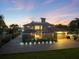 Stunning waterfront home with a screened pool, rooftop deck, and an oversized garage at 2322 Bayshore Rd, Nokomis, FL 34275