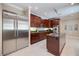 Gourmet kitchen with stainless steel appliances, custom cabinetry, granite countertops and central island at 2322 Bayshore Rd, Nokomis, FL 34275