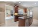Open concept kitchen with granite counters, custom cabinetry, and modern appliances at 2322 Bayshore Rd, Nokomis, FL 34275