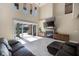 Spacious living room with tall ceilings, fireplace, tile floors, and views of the outdoor area at 2322 Bayshore Rd, Nokomis, FL 34275
