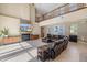 Open living room with high ceilings, stone fireplace, entertainment center and comfortable seating at 2322 Bayshore Rd, Nokomis, FL 34275