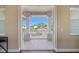 Covered patio with tile flooring provides a view of the neighborhood at 2322 Bayshore Rd, Nokomis, FL 34275