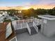 Relax on the rooftop deck with sunrise views of the neighborhood and water at 2322 Bayshore Rd, Nokomis, FL 34275