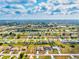 Wide aerial shot displaying the neighborhood and surrounding community, highlighting the property's setting at 269 Mark Twain Ln, Rotonda West, FL 33947