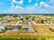 An aerial shot showcases the home's premium lot, pool, landscaping, and neighborhood amenities at 269 Mark Twain Ln, Rotonda West, FL 33947