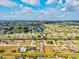 Overhead view featuring the property situated among the community's streets, waterways, and golf course at 269 Mark Twain Ln, Rotonda West, FL 33947