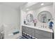 Bright bathroom featuring double sinks, vanity, tub and decorative accents at 269 Mark Twain Ln, Rotonda West, FL 33947