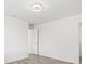 This bedroom features light wood floors, white walls and neutral trim, with a ceiling light fixture at 269 Mark Twain Ln, Rotonda West, FL 33947